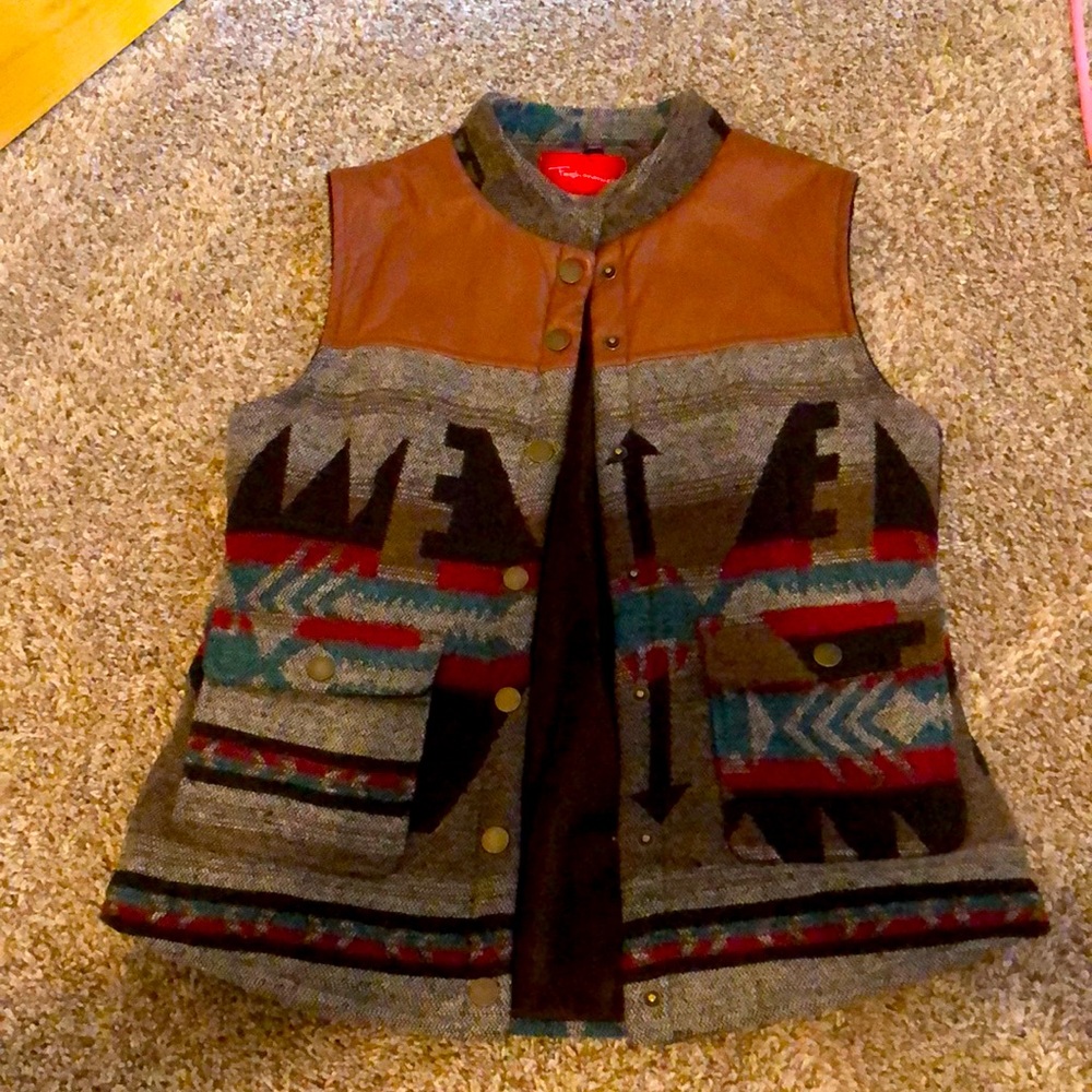 Super cute fall vest to wear over sweaters